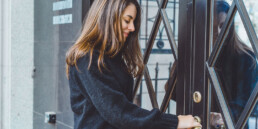 Woman opening a door